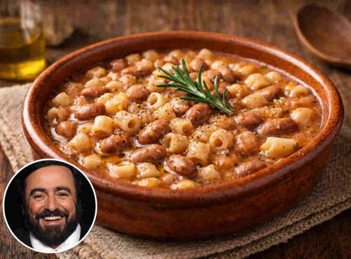 Ciotola in coccio con all'interno una pasta e fagioli profumata e cremosa e in un angolo la foto del cantante lirico Luciano Pavarotti